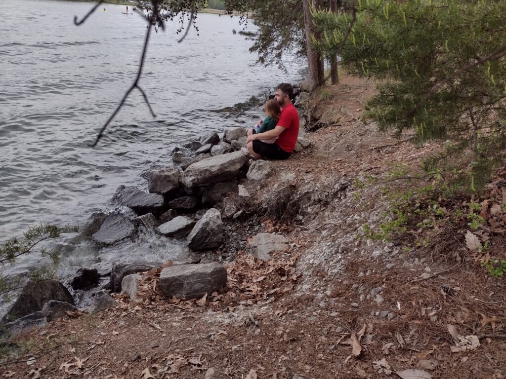 Devils Fork Lakeshore. My son and his daughter at the waters edge.